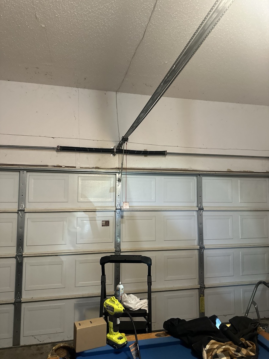 Broken garage door spring repair in Garland TX